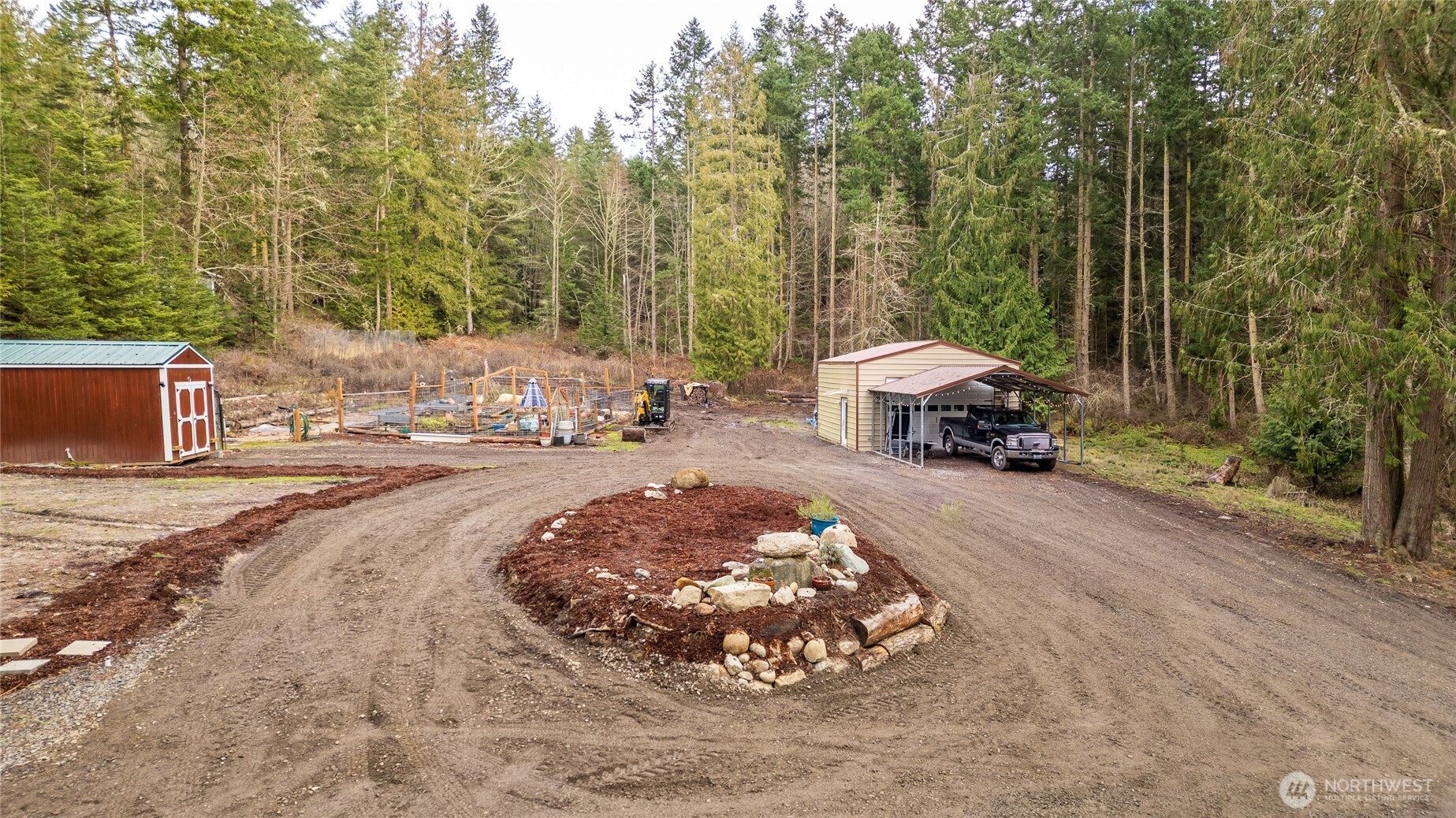 193 Springwater Lane Sequim, WA 98382 - Photo 6 of 40 a view of a street with large trees