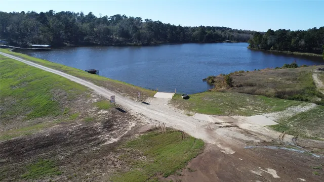 a view of a swimming pool with a yard
