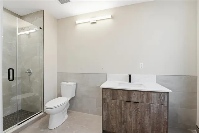 a bedroom with a bed and a table