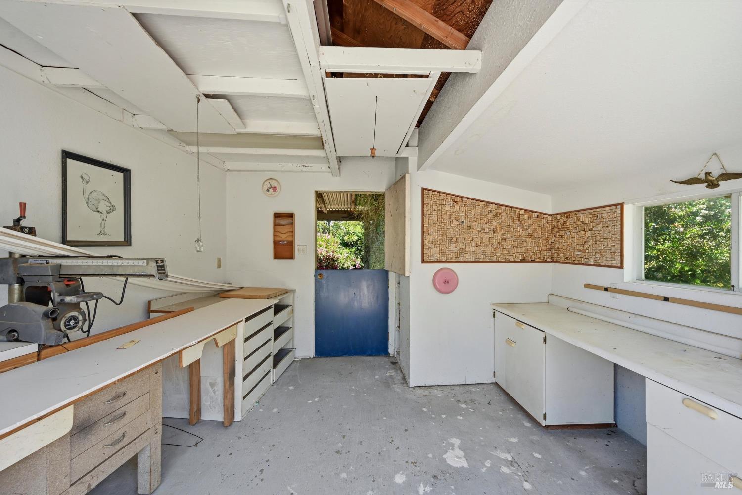 4941 Hansen Drive Santa Rosa, CA 95409 - Photo 29 of 35 This sweet workshop is perfect for wood working or crafting. The Dutch door at the back allows for cross breeze.