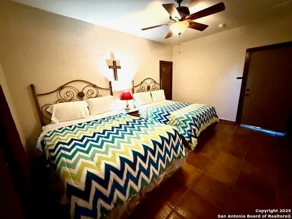 a bathroom with a sink vanity mirror and toilet