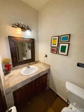 a bedroom with double bed and a chandelier