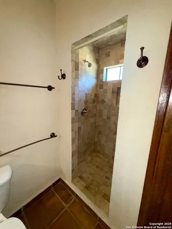 a view of a room with painting on the wall