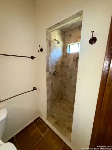 a view of a room with painting on the wall