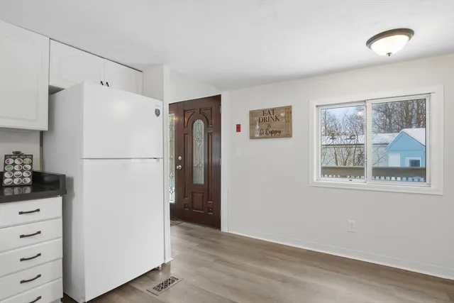 a white refrigerator freezer sitting in a kitchen