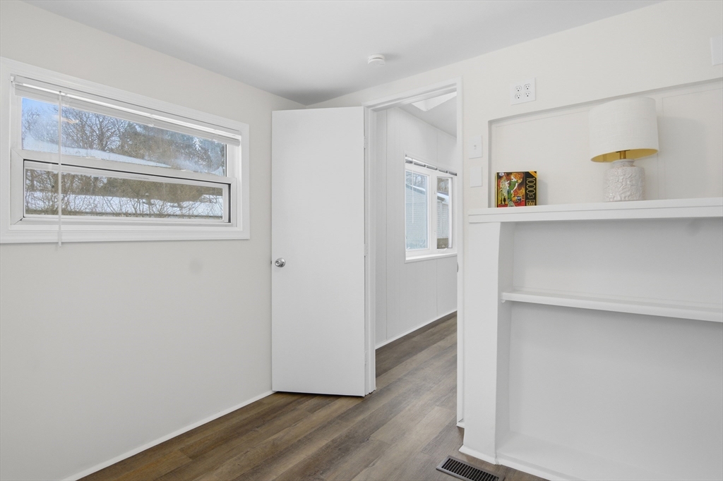 18 Maple Street, Unit 14 Pepperell, MA 01463 - Photo 17 of 27 a view of kitchen with wooden floor and cabinets