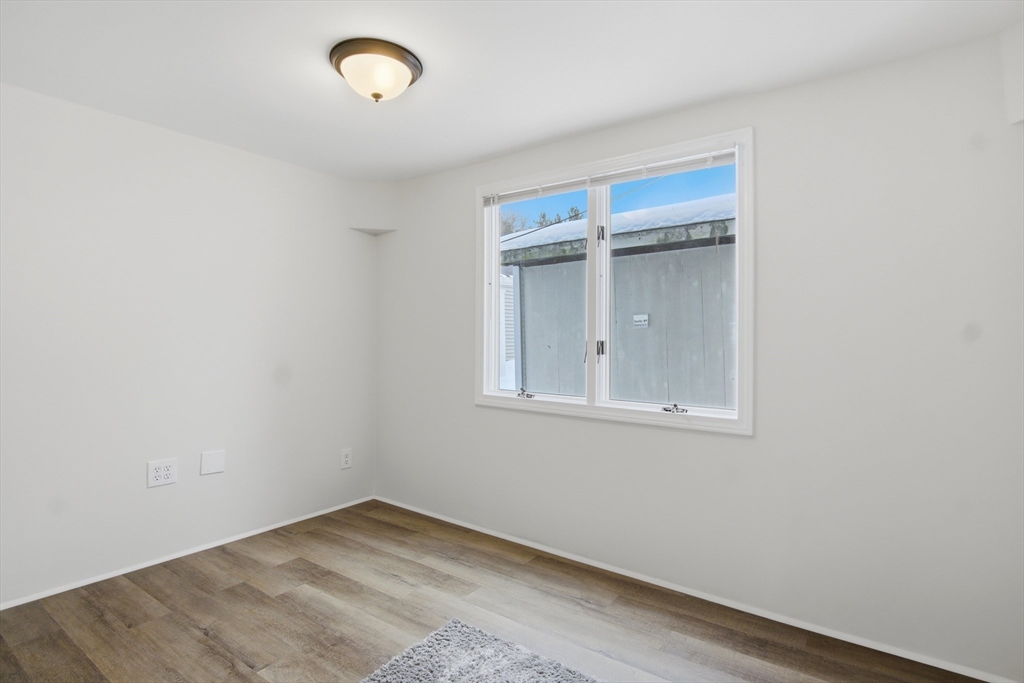 18 Maple Street, Unit 14 Pepperell, MA 01463 - Photo 21 of 27 an empty room with a window