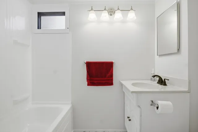 a bathroom with a sink and a tub