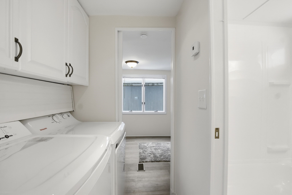 18 Maple Street, Unit 14 Pepperell, MA 01463 - Photo 24 of 27 a bathroom with a sink and a mirror