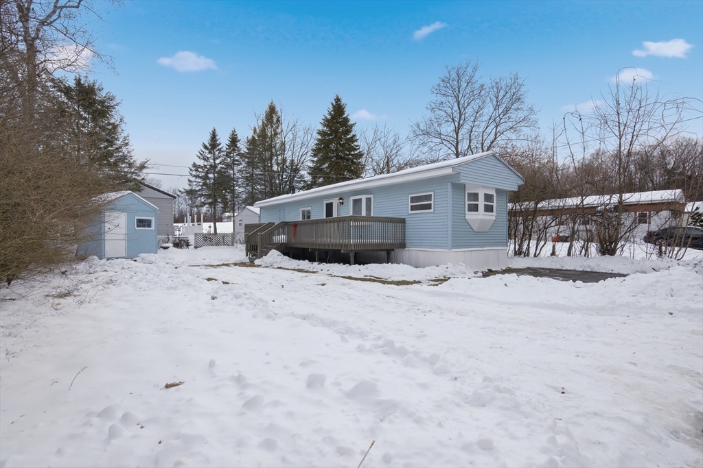 18 Maple Street, Unit 14 Pepperell, MA 01463 - Photo 27 of 27 a view of a house with a snow in the yard