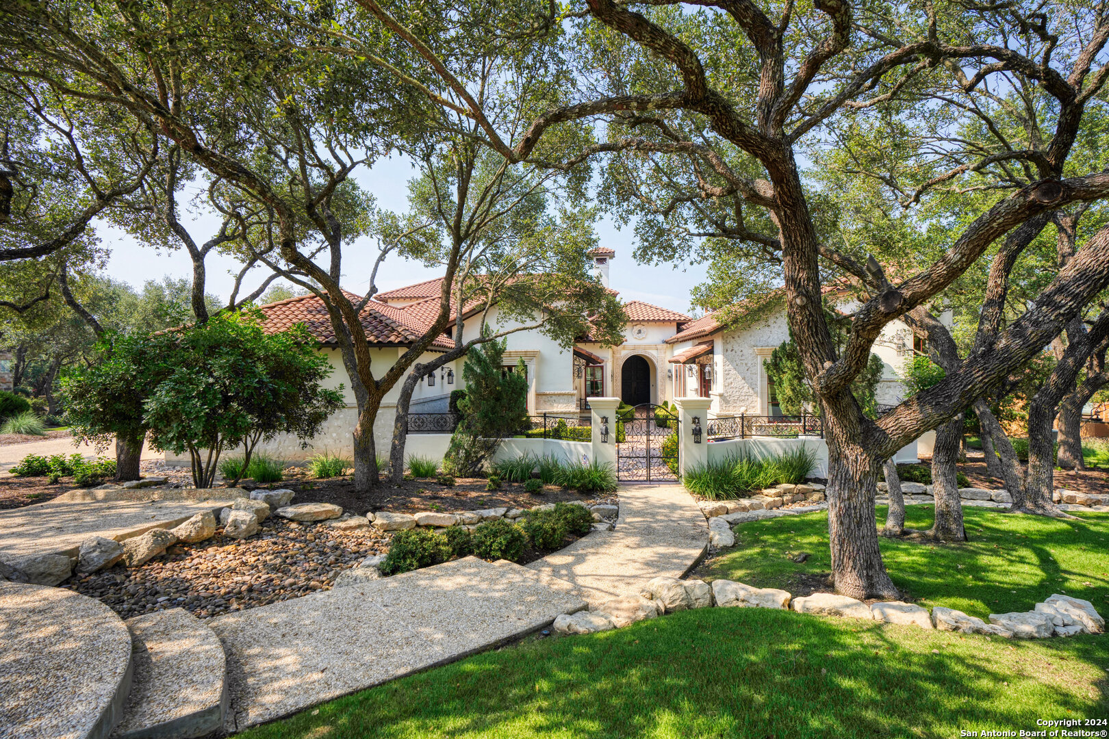 211 Augusta Boerne, TX 78006 - Photo 14 of 59 a front view of a house with garden