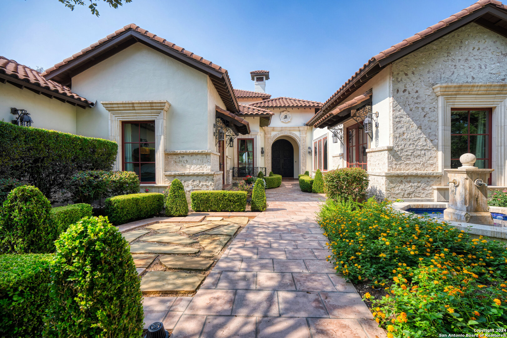 211 Augusta Boerne, TX 78006 - Photo 15 of 59 a front view of a house with garden and plants
