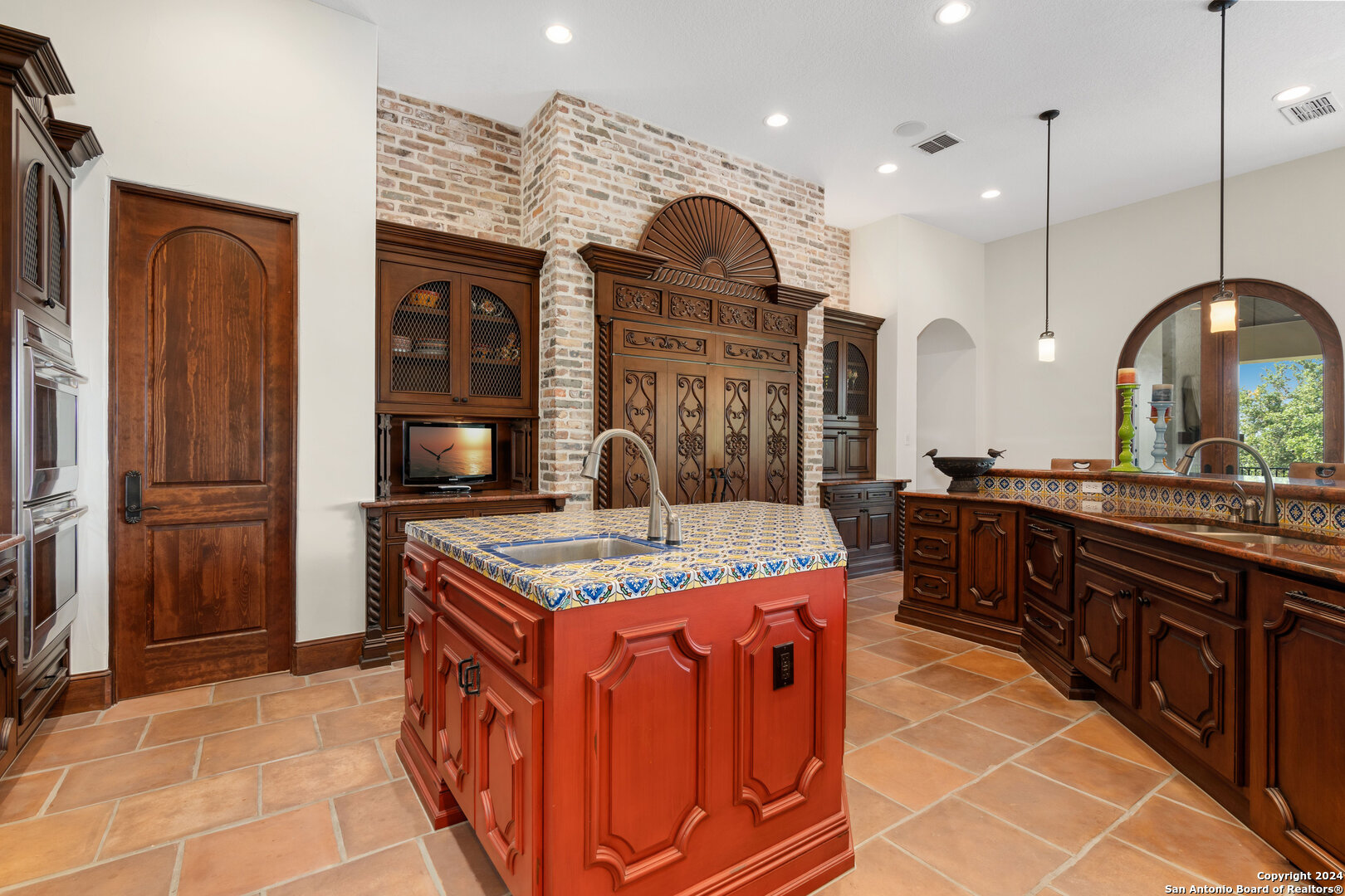 211 Augusta Boerne, TX 78006 - Photo 28 of 59 a kitchen with stainless steel appliances granite countertop a stove a sink and a refrigerator