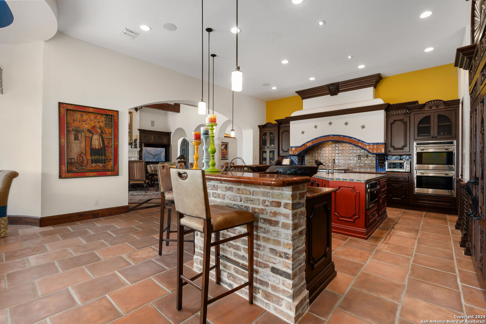211 Augusta Boerne, TX 78006 - Photo 30 of 59 a kitchen with stainless steel appliances kitchen island granite countertop a stove a sink and a refrigerator