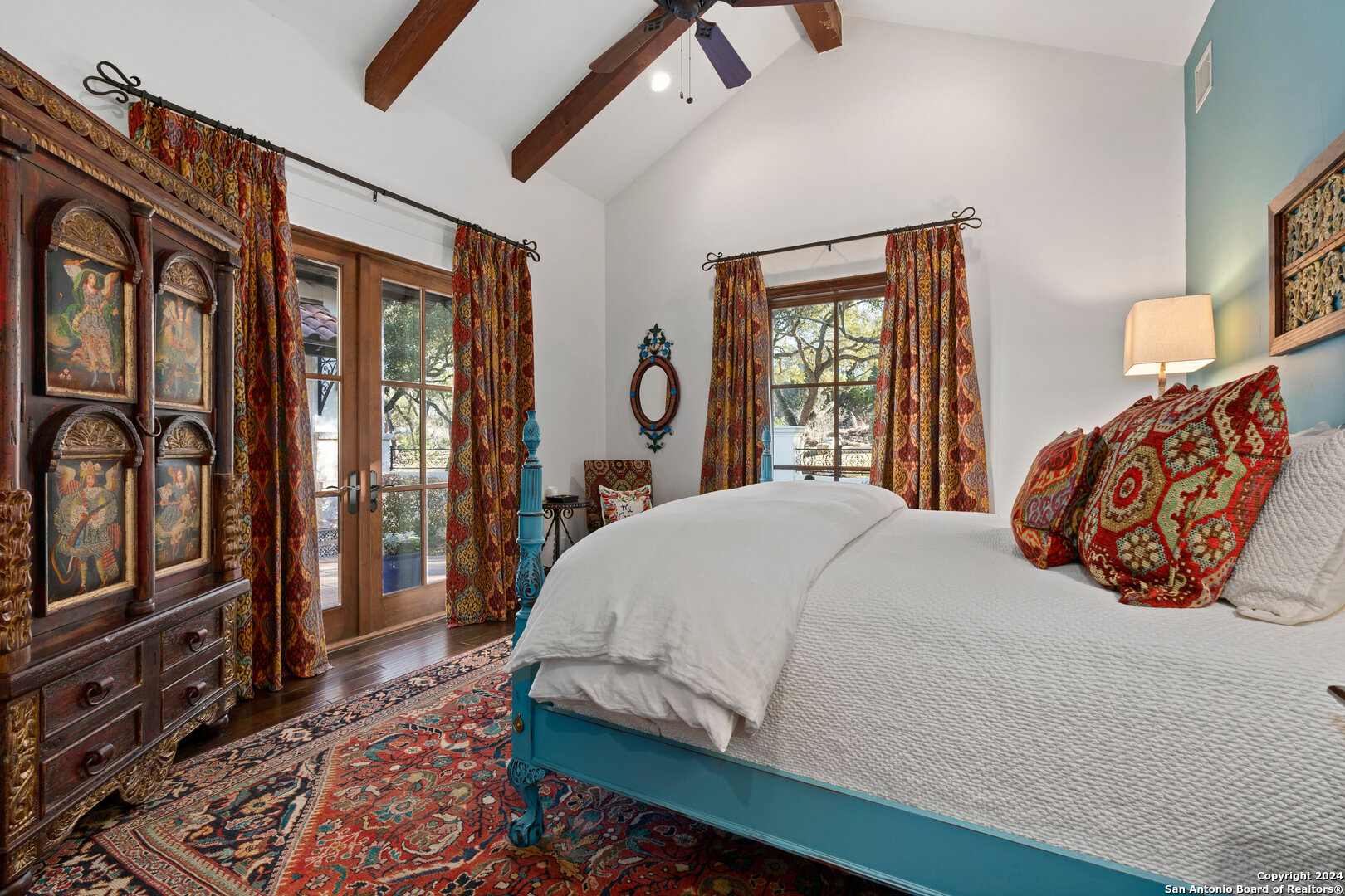 211 Augusta Boerne, TX 78006 - Photo 45 of 59 a bedroom with a large bed and wooden floor