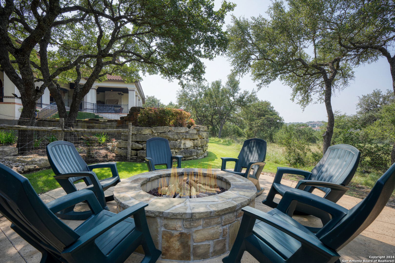 211 Augusta Boerne, TX 78006 - Photo 57 of 59 a view of patio with table and chairs potted plants and a large tree