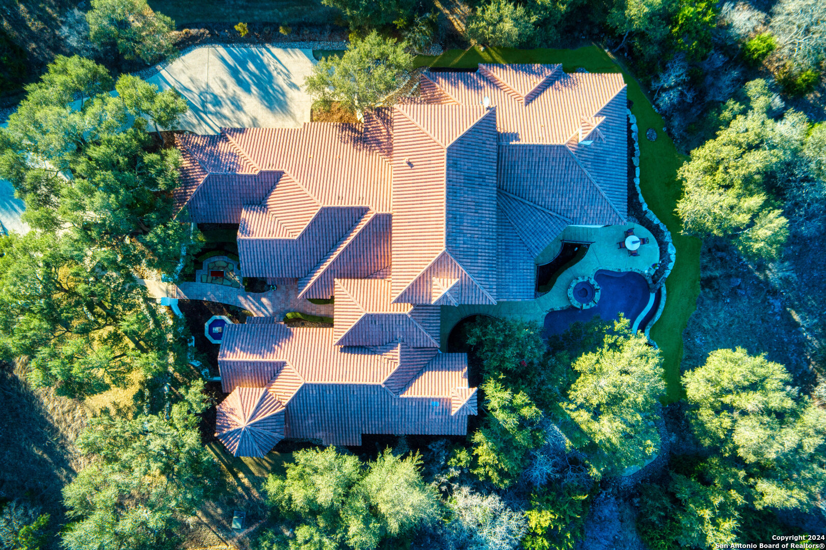 211 Augusta Boerne, TX 78006 - Photo 10 of 59 a view of a house with a yard and garden
