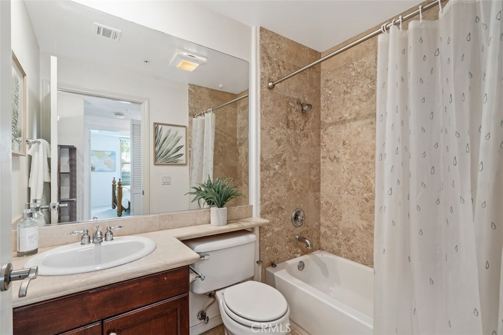128 North Oak Knoll Avenue, Unit 317 Pasadena, CA 91101 - Photo 11 of 22 a bathroom with a sink toilet a mirror and shower