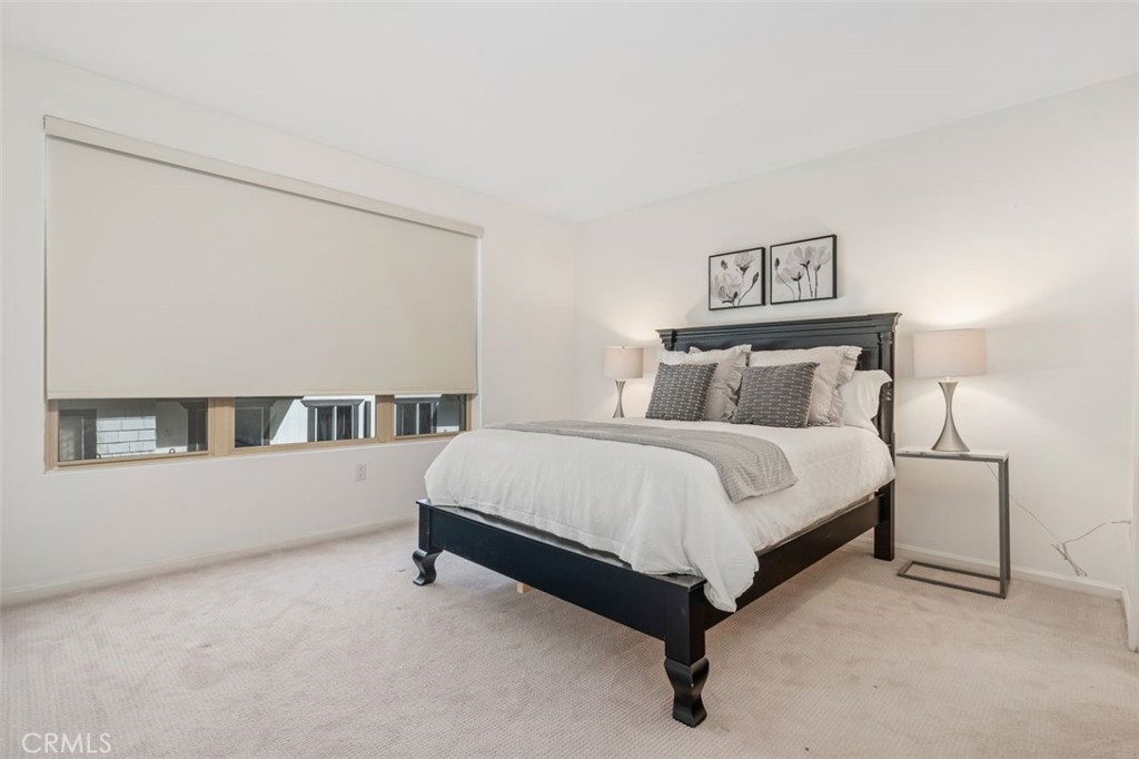 128 North Oak Knoll Avenue, Unit 317 Pasadena, CA 91101 - Photo 13 of 22 a bed room with a bed and a night stand