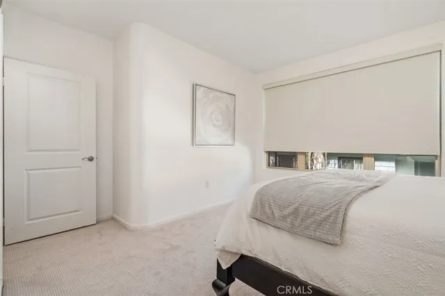 a bedroom with a bed and a cabinets