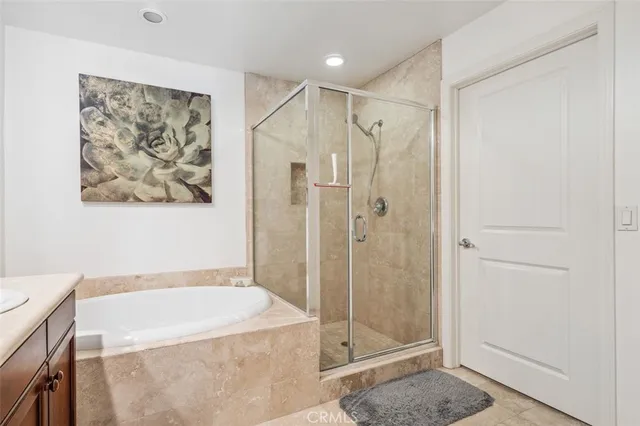 a spacious bathroom with a shower and a sink