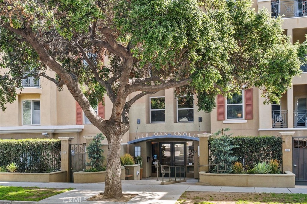 128 North Oak Knoll Avenue, Unit 317 Pasadena, CA 91101 - Photo 21 of 22 a front view of a house with garden