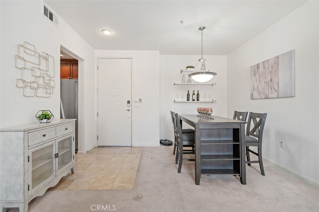 128 North Oak Knoll Avenue, Unit 317 Pasadena, CA 91101 - Photo 3 of 22 a view of a dining room with furniture