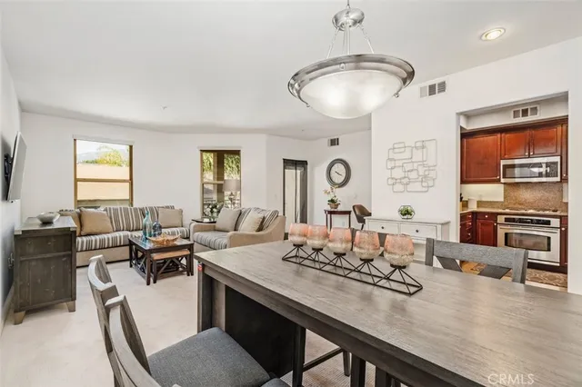 a view of a dining room with furniture window and outside view