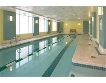 a bathroom with a sink mirror and a bath tub