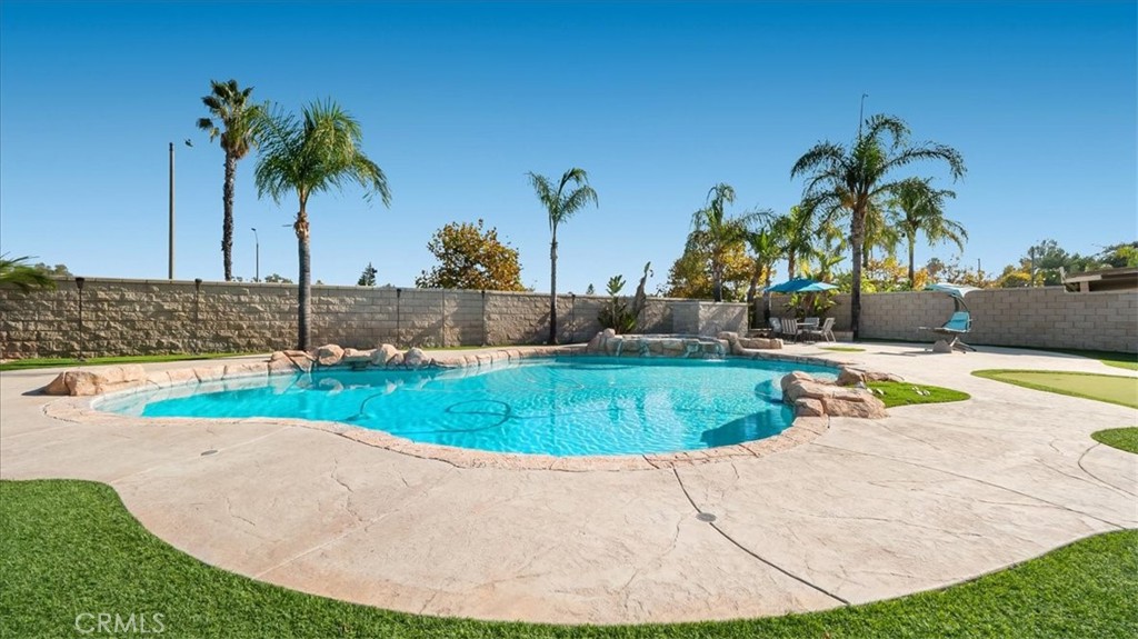 321 Adirondack Drive Corona, CA 92881 - Photo 16 of 22 a view of a swimming pool with a yard