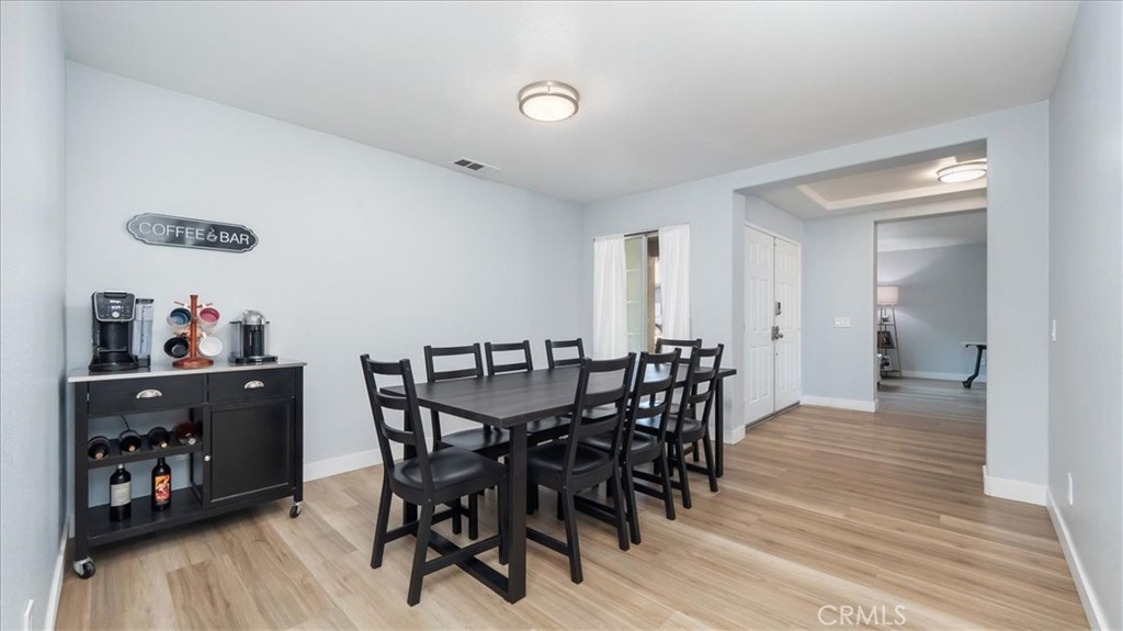 321 Adirondack Drive Corona, CA 92881 - Photo 3 of 22 a view of a dining room with furniture and wooden floor