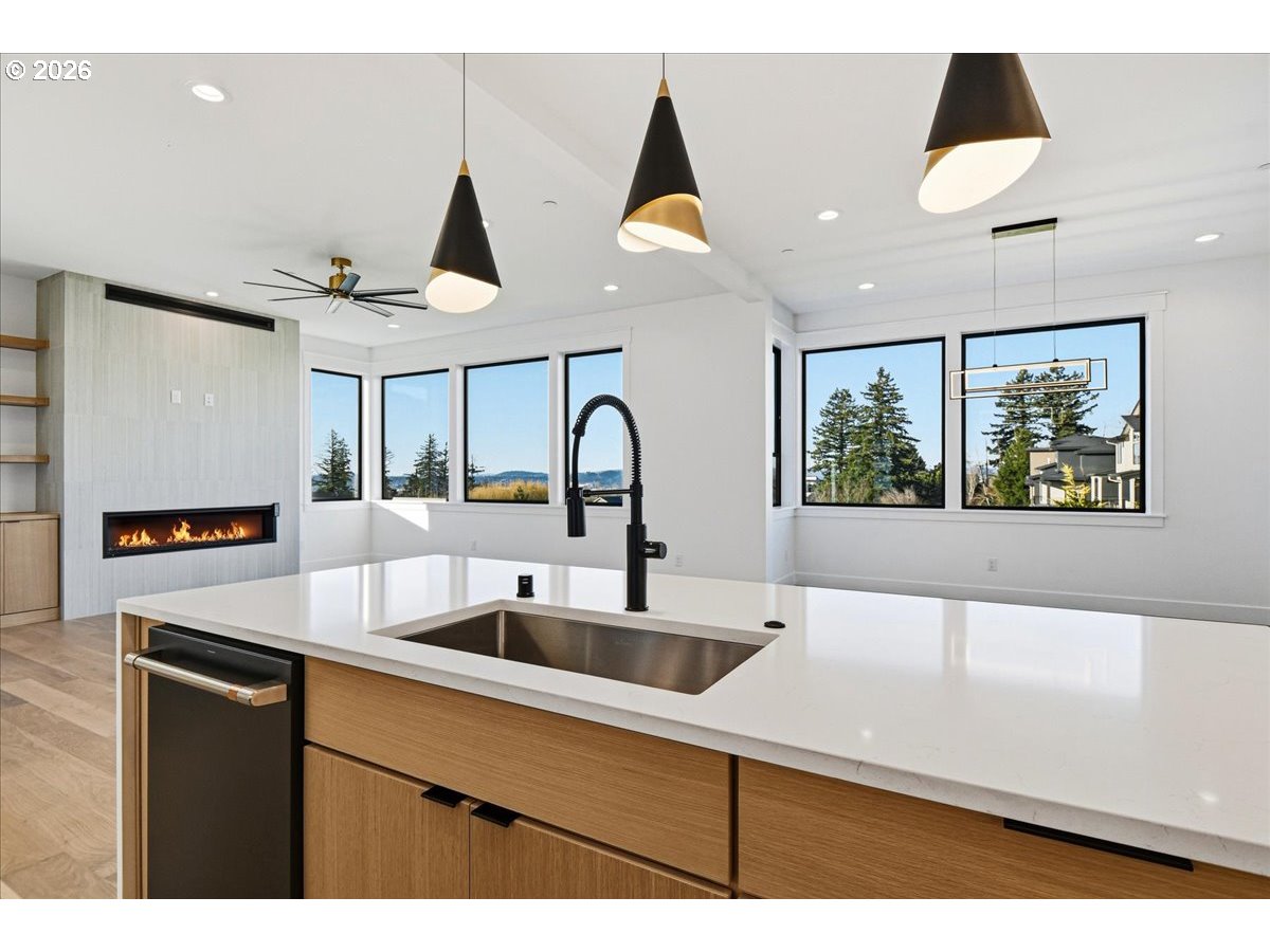 1597 Northwest Goodwin Street Camas, WA 98607 - Photo 12 of 44 a kitchen with a sink a counter top space and a window