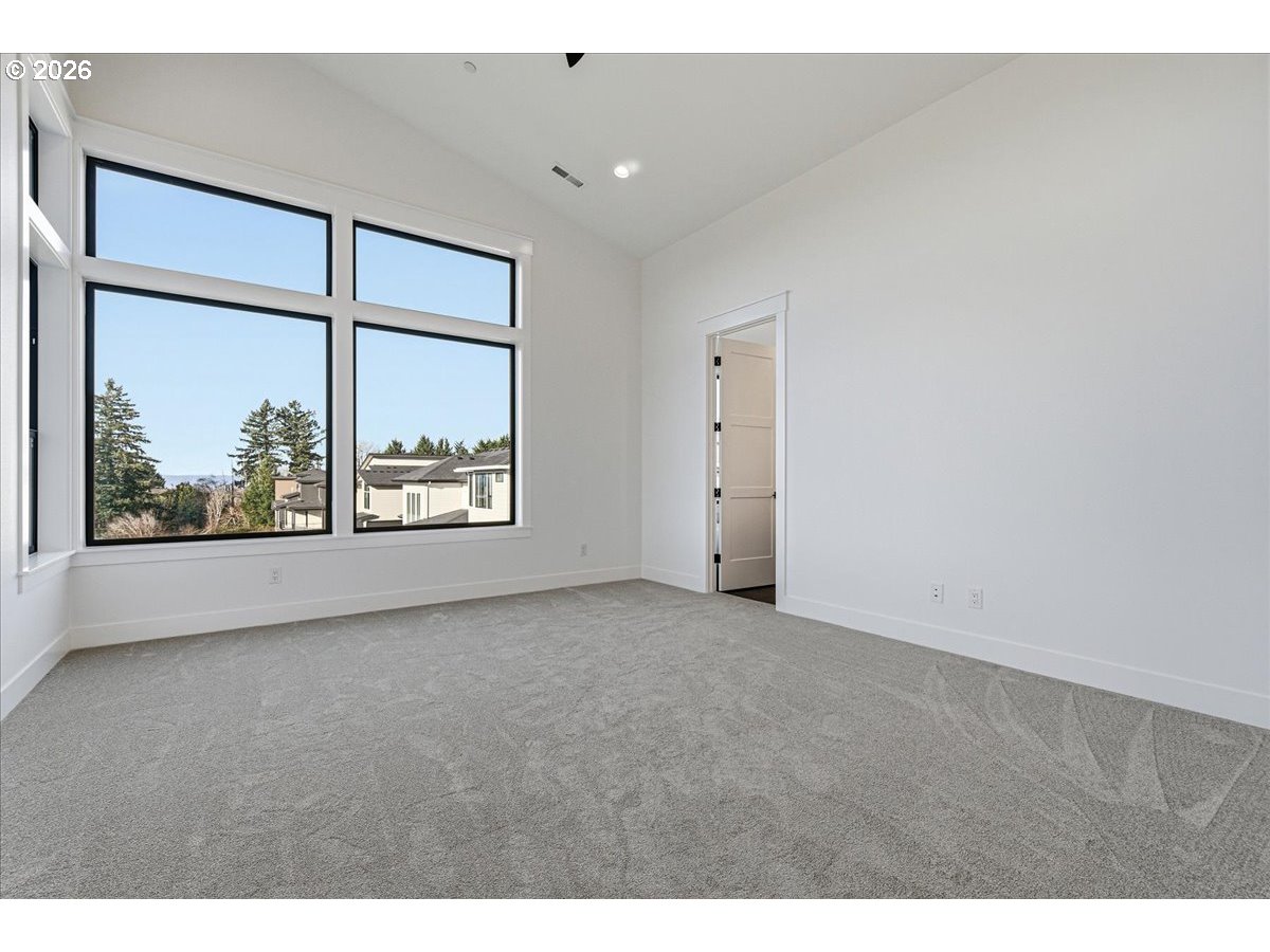 1597 Northwest Goodwin Street Camas, WA 98607 - Photo 24 of 44 a view of a big room with windows and chandelier fan