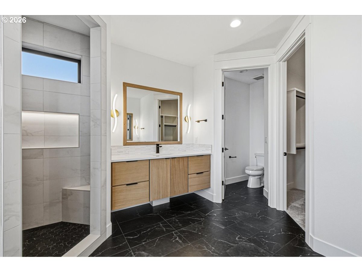 1597 Northwest Goodwin Street Camas, WA 98607 - Photo 27 of 44 a bathroom with a sink and a mirror
