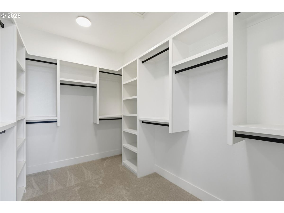 1597 Northwest Goodwin Street Camas, WA 98607 - Photo 32 of 44 a view of empty room with refrigerator and wooden floor