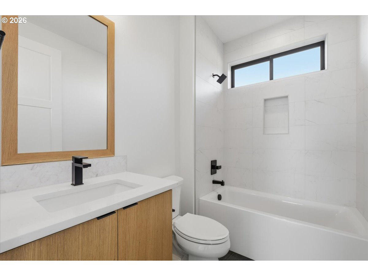 1597 Northwest Goodwin Street Camas, WA 98607 - Photo 34 of 44 a bathroom with a sink a toilet and shower