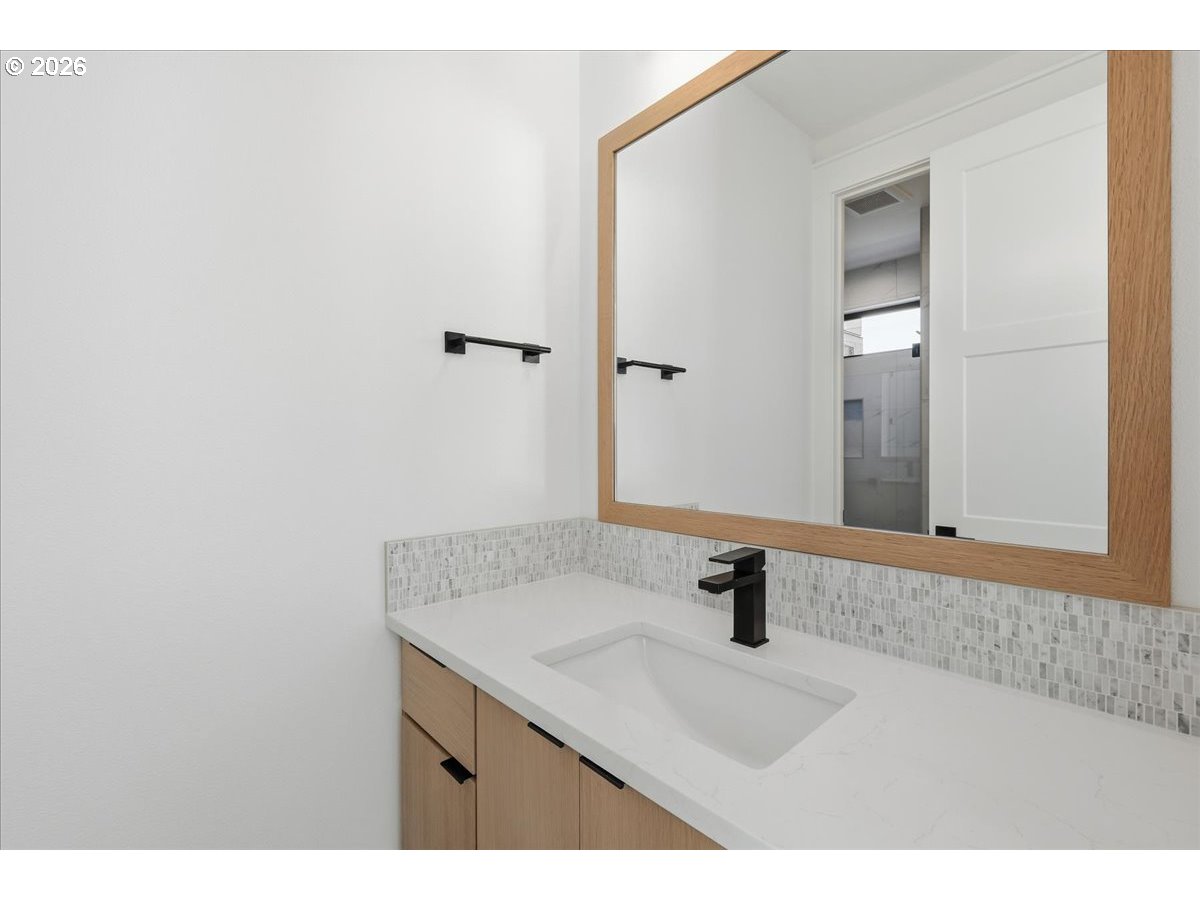 1597 Northwest Goodwin Street Camas, WA 98607 - Photo 36 of 44 a bathroom with a sink and a mirror