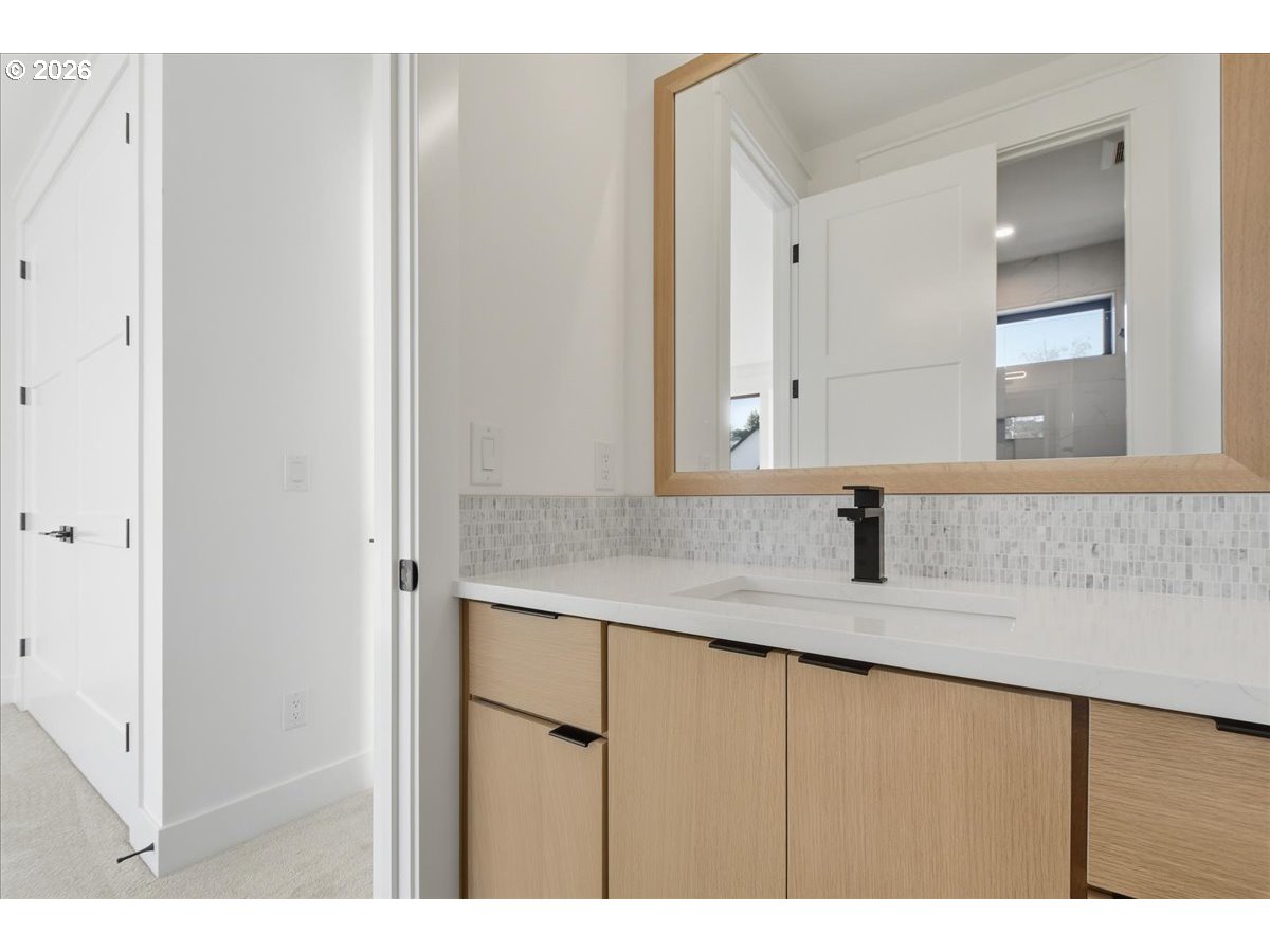 1597 Northwest Goodwin Street Camas, WA 98607 - Photo 38 of 44 a bathroom with a granite countertop sink and mirror