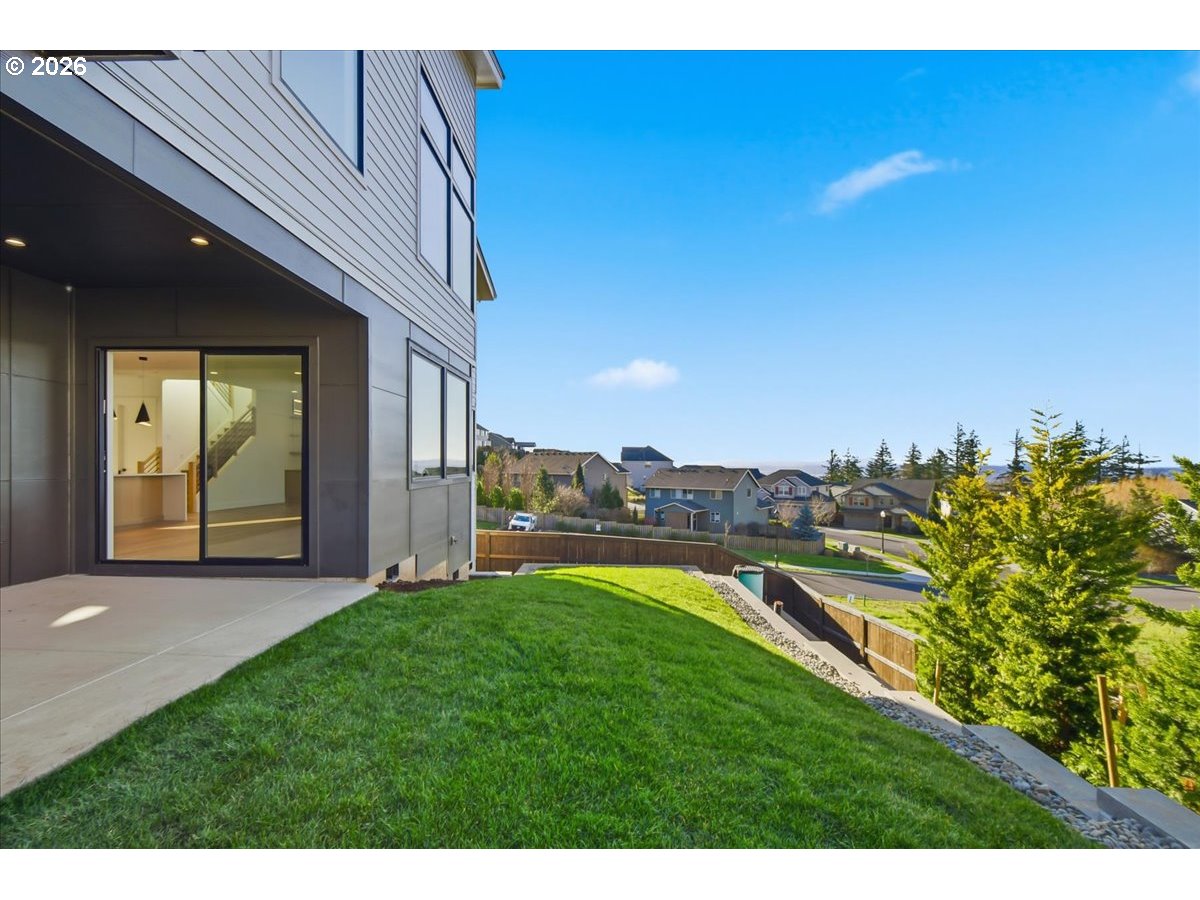 1597 Northwest Goodwin Street Camas, WA 98607 - Photo 42 of 44 a view of a backyard with plants and a patio