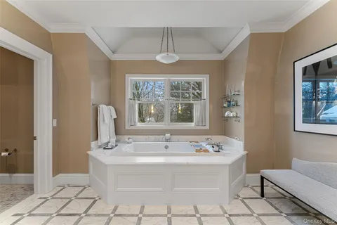 a bathroom with a sink a mirror and a window