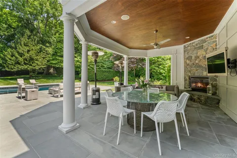 a dining room with furniture and a garden