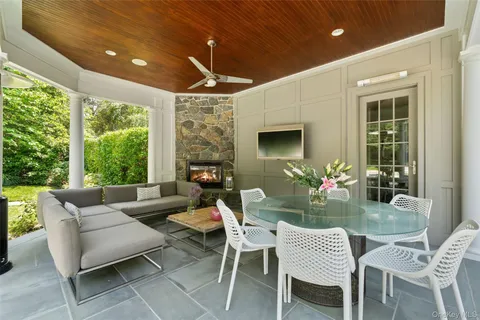 a outdoor space with patio furniture and garden view