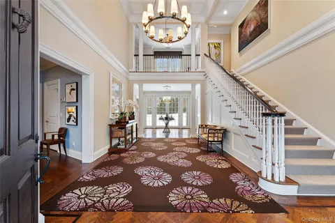 a view of an entryway with wooden floor