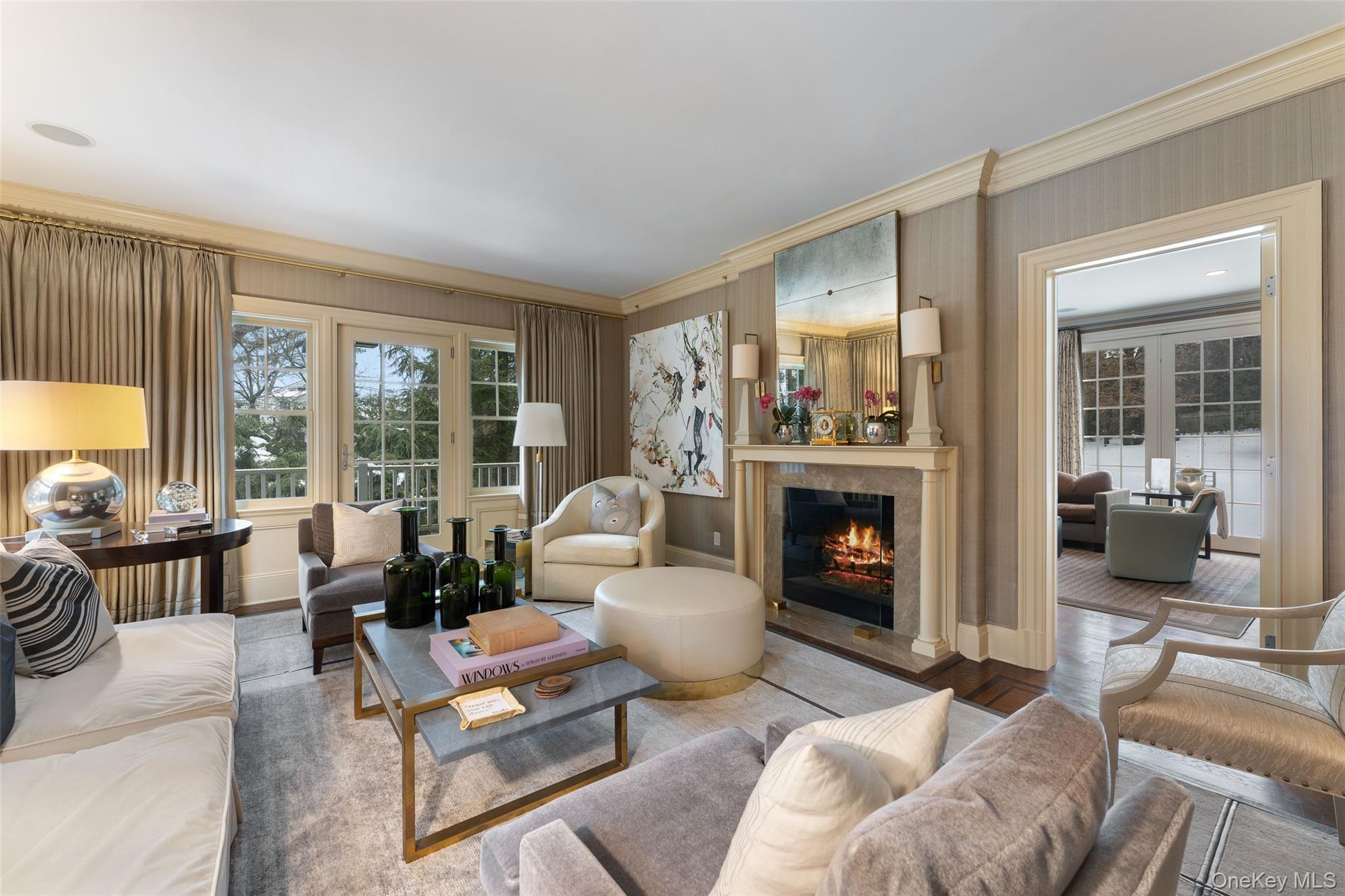 35 Eton Road Scarsdale, NY 10583 - Photo 7 of 43 View of living room with gas fireplace open to the family room
