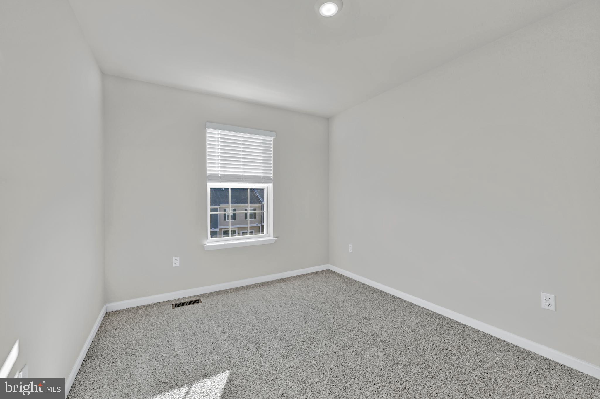 5018 Silver Oak Drive Rosedale, MD 21237 - Photo 15 of 19 a view of an empty room with a window