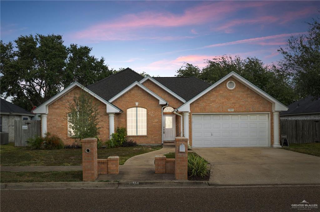 604 Hidden Trace Weslaco, TX 78599 - Photo 1 of 20 front view of a house with a yard