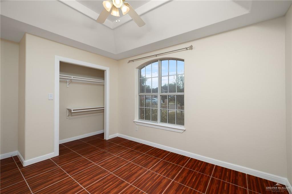 604 Hidden Trace Weslaco, TX 78599 - Photo 13 of 20 a view of an empty room with a window