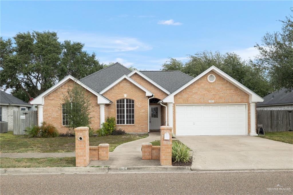 604 Hidden Trace Weslaco, TX 78599 - Photo 16 of 20 front view of a house with a yard
