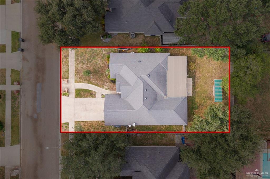 604 Hidden Trace Weslaco, TX 78599 - Photo 18 of 20 an aerial view of a house with a yard and lake view
