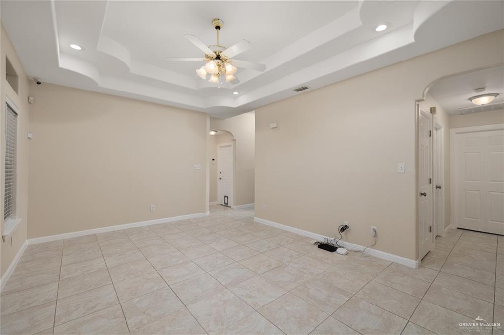 604 Hidden Trace Weslaco, TX 78599 - Photo 2 of 20 a view of an empty room with a chandelier fan